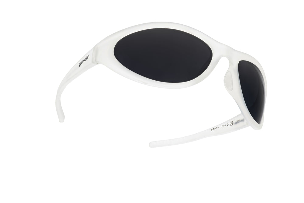 Side-front angle of goodr BugG Cleared for Takeoff sunglasses showing sleek clear frames, polarized dark lenses, and sport-ready no-slip, no-bounce performance.