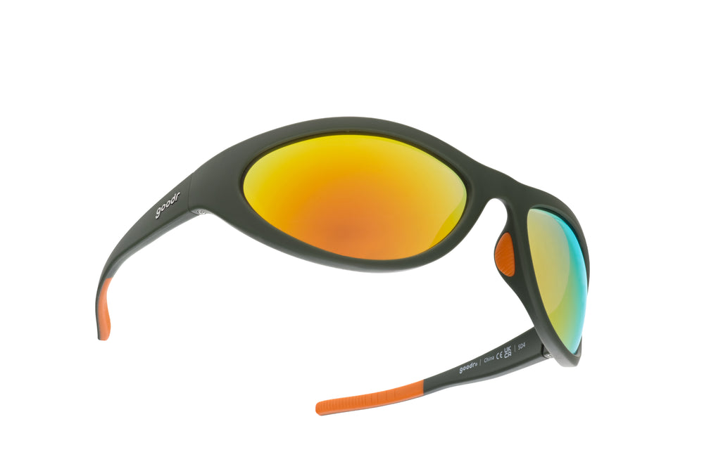 goodr Bug G Grass Stain Hall of Fame sunglasses with green wrap-around frame and amber mirrored lenses, designed with no-slip, no-bounce performance for sports and active lifestyles.