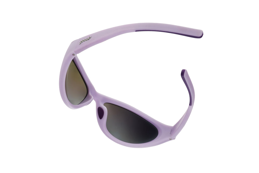 Overhead view of goodr BugG sunglasses partially folded, showcasing the aerodynamic design and dark inner lens tint.