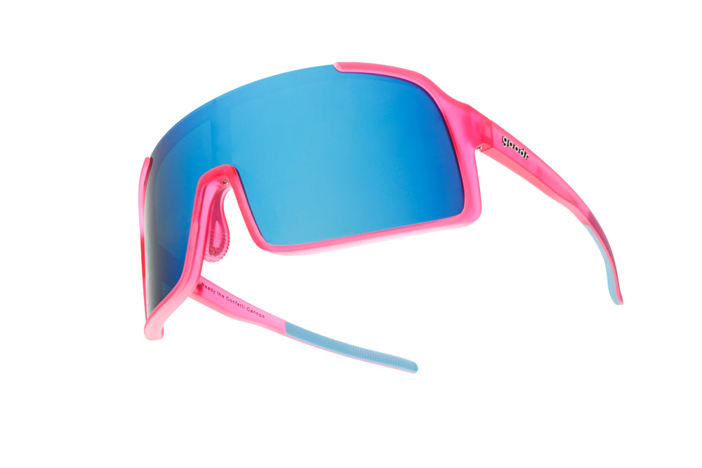 Goodr Shield Astro G sunglasses in Ready the Confetti Canon style with pink frame and blue gradient lenses, perfect for sporty and stylish outdoor wear.