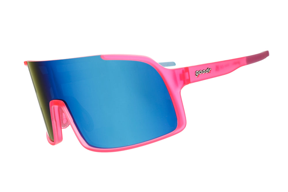 Goodr Shield Astro G sunglasses in Ready the Confetti Canon style with pink frame and blue gradient lenses, perfect for sporty and stylish outdoor wear.