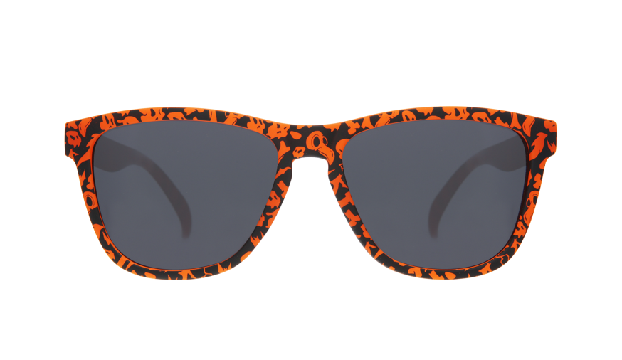 Goodr OG limited edition sunglasses 'EXERCISE THE DEMONS!!!' – Halloween-inspired orange and black pattern sunglasses with polarized dark lenses, lightweight no-slip frame designed for running, workouts, and spooky fun.