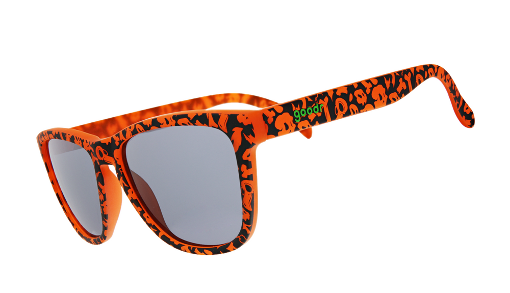 Goodr OG limited edition sunglasses 'EXERCISE THE DEMONS!!!' – Halloween-inspired orange and black pattern sunglasses with polarized dark lenses, lightweight no-slip frame designed for running, workouts, and spooky fun.