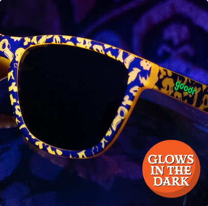 Goodr OG limited edition sunglasses 'EXERCISE THE DEMONS!!!' – Halloween-inspired orange and black pattern sunglasses with polarized dark lenses, lightweight no-slip frame designed for running, workouts, and spooky fun.