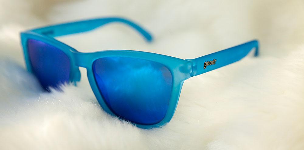 Goodr Falkor's Fever Dream OG running sunglasses with vibrant blue frame and blue polarized UV400 lenses — no-slip, no-bounce performance for running and outdoor activities.