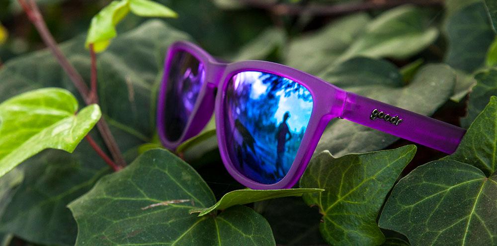 Goodr Gardening with a Kraken OG running sunglasses with purple frame and purple polarized UV400 lenses — no-slip, no-bounce fit for running and outdoor sports.