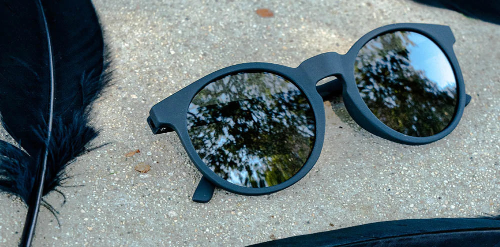 Goodr Circle G "It's Not Black, It's Obsidian" — round black running sunglasses with a sleek obsidian black frame and polarized lenses. Designed for a no-slip, no-bounce fit, perfect for runners seeking style and reliable performance.