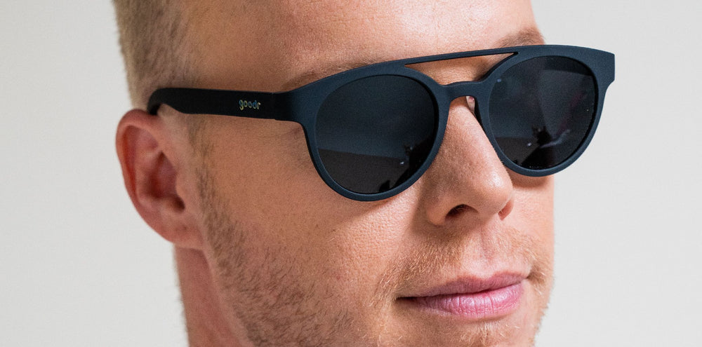 goodr PHG polarized sunglasses Professor 00G model with all-black frame and lenses, no slip no bounce fit, perfect for runners and outdoor enthusiasts seeking sleek style and performance.