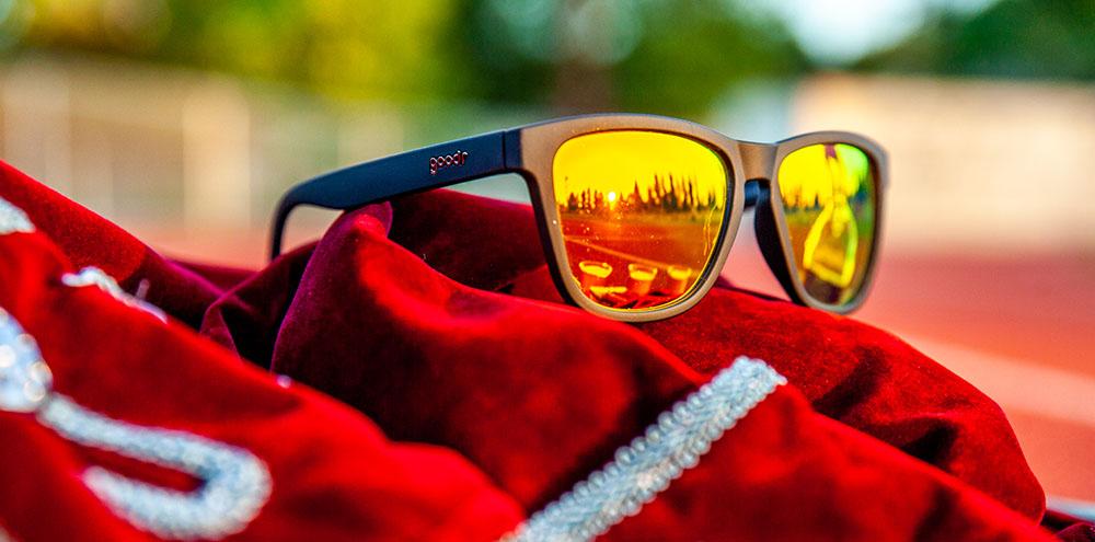 Goodr Whiskey Shots with Satan OG running sunglasses with black frame and amber polarized UV400 lenses — no-slip, no-bounce performance for running and outdoor adventures.