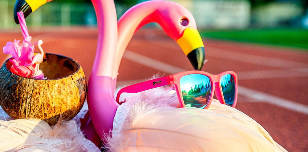 Goodr Flamingos on a Booze Cruise OG running sunglasses with bright pink frame and polarized UV400 lenses — perfect no-slip, no-bounce sunglasses for running and fitness.