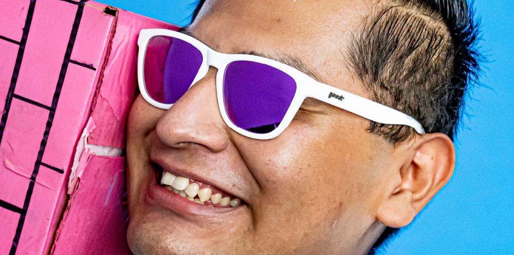 goodr OG running sunglasses Side Scroll Eye Roll model with white frame and purple polarized lenses, no slip no bounce fit, and all polarized lenses—ideal for running and active lifestyles.