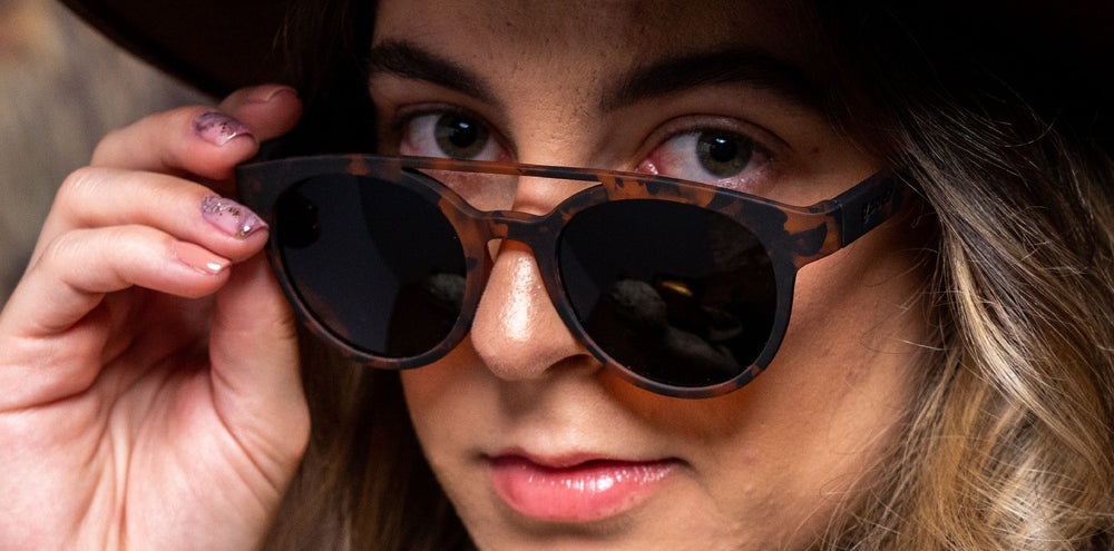 goodr PHG polarized sunglasses ARTIFACTS, NOT ARTIFEELINGS model with tortoise shell frame, no slip no bounce fit, and polarized lenses offering stylish protection for active lifestyles