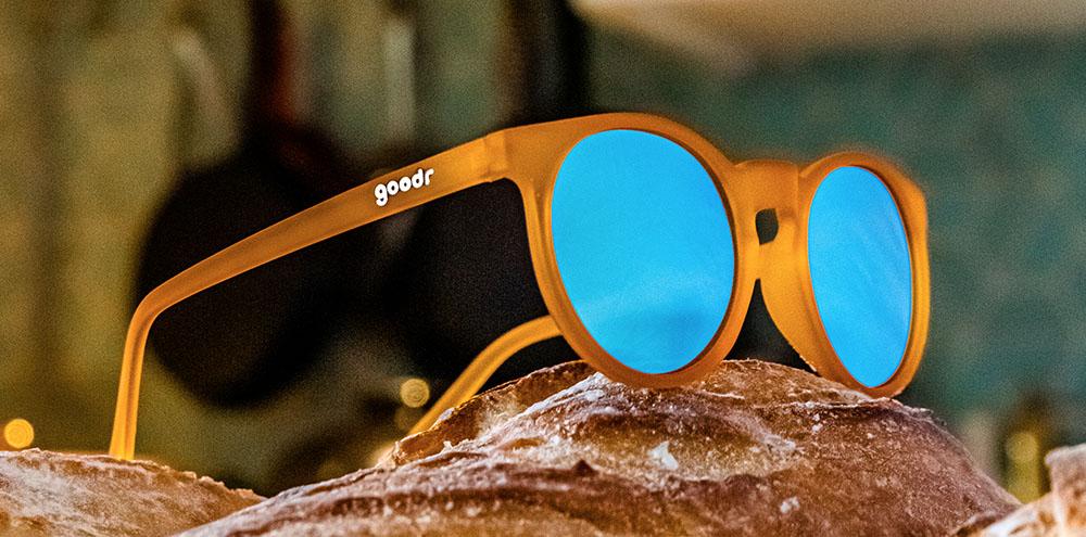 Circle G running sunglasses Freshly Baked Man Buns model with orange frame and blue round polarized lenses, offering no slip no bounce fit for optimal comfort during sports