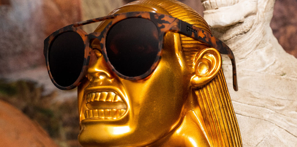 goodr PHG polarized sunglasses ARTIFACTS, NOT ARTIFEELINGS model with tortoise shell frame, no slip no bounce fit, and polarized lenses offering stylish protection for active lifestyles