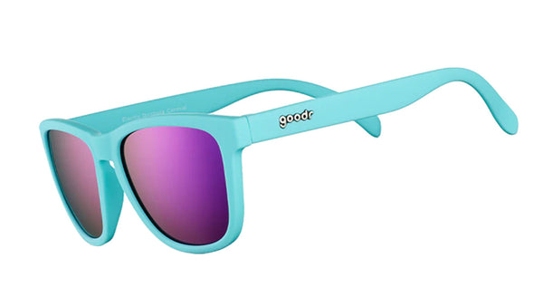 Goodr Electric Dinotopia Carnival OG running sunglasses with vibrant pink and purple frame, polarized UV400 lenses, and no-slip, no-bounce design — ideal for running and active lifestyles.