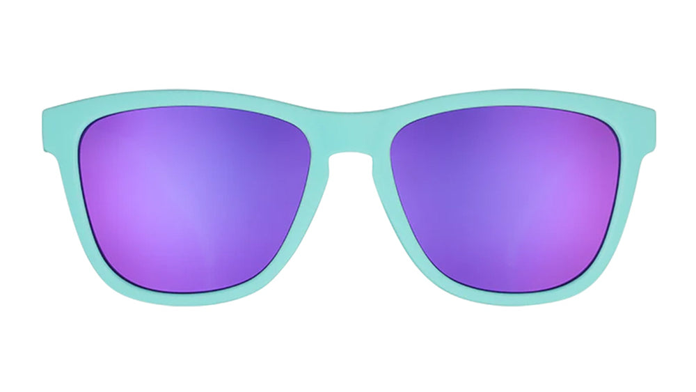 Goodr Electric Dinotopia Carnival OG running sunglasses with vibrant pink and purple frame, polarized UV400 lenses, and no-slip, no-bounce design — ideal for running and active lifestyles.